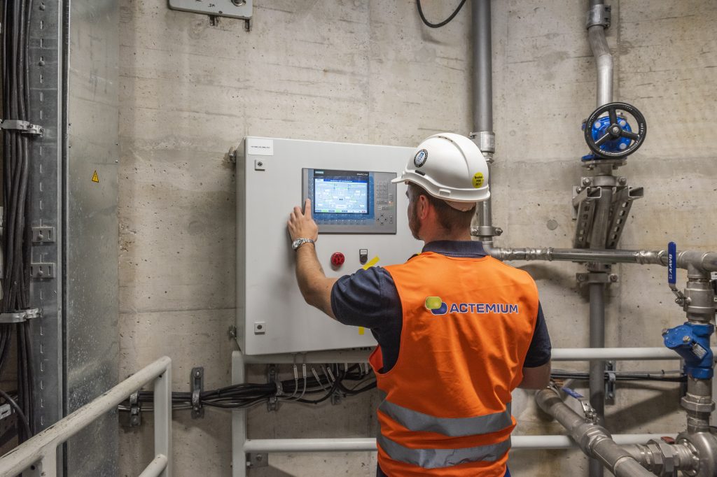 Control Systems Engineer updating plant's control systems to mitigate cybersecurity risks